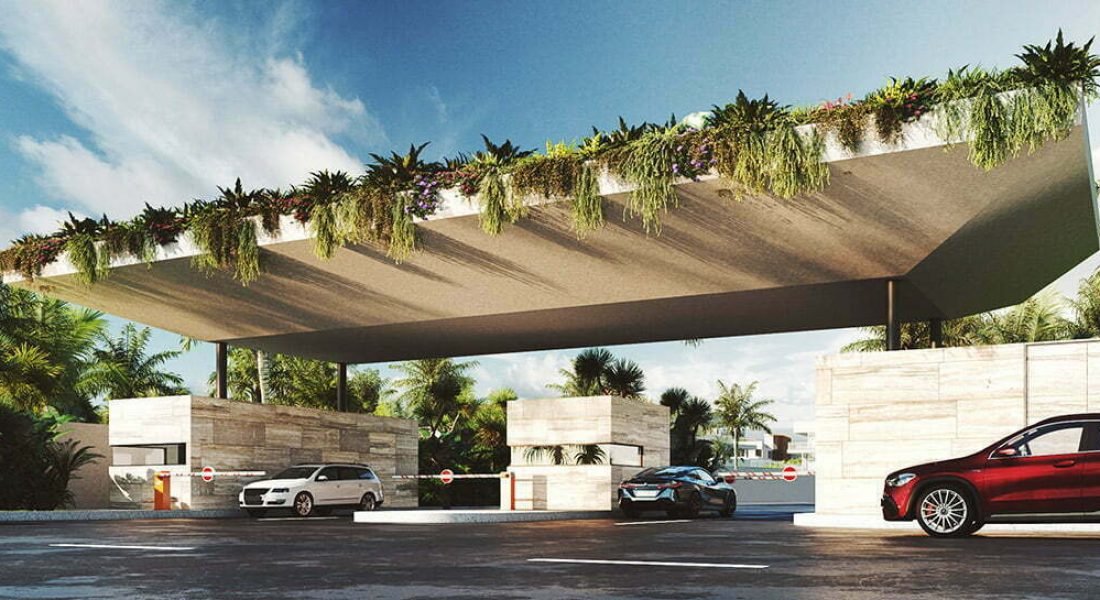 Entrada al proyecto The Leaf con caseta de seguridad y acceso controlado